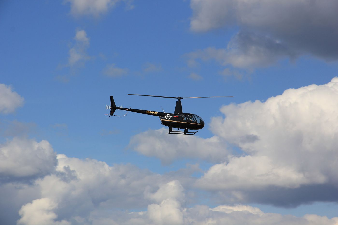 Helicopter flying among clouds